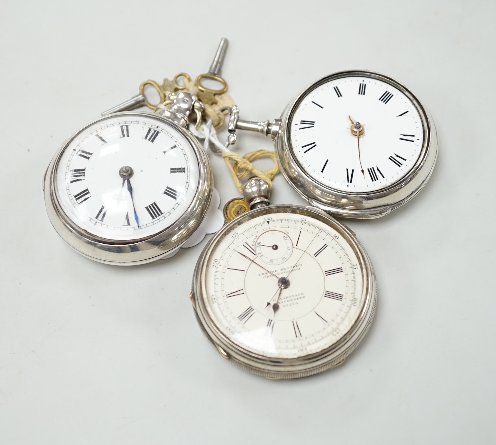 Three assorted silver pocket watches, including two pair cased and an open faced chronograph, by Aaronson, Manchester.